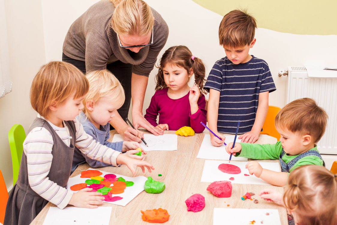 Teacher Teaching Kids at Arts Class 