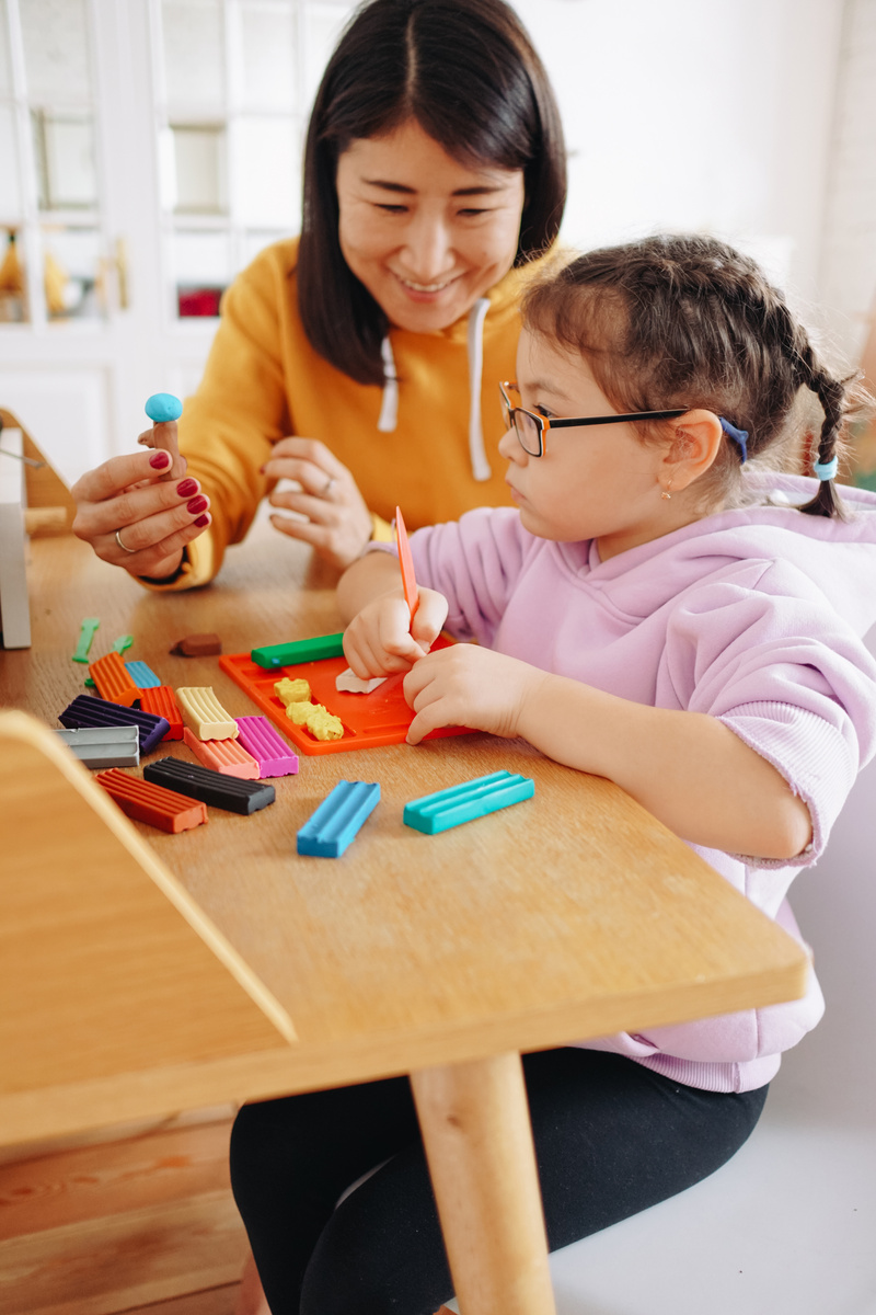 Woman Teaching Child